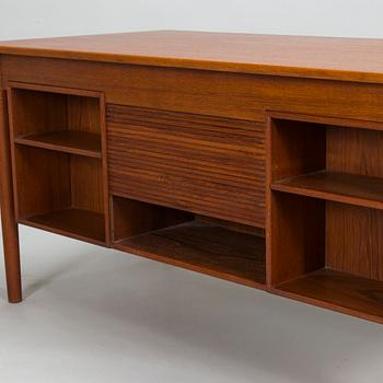 A wooden mid 20th century desk.