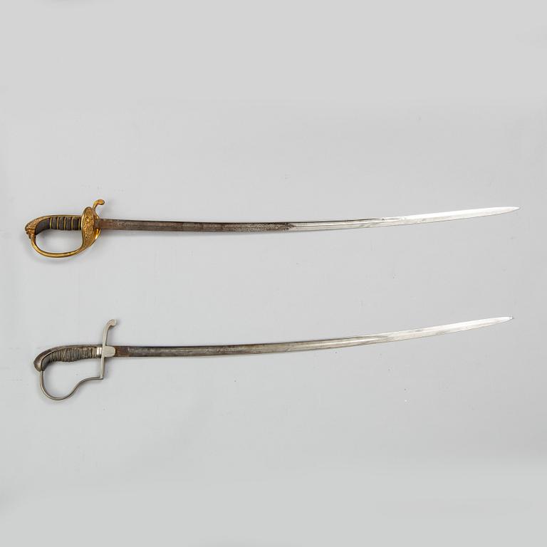 Two Swedish sabres, end of the 19th Century, with scabbards.