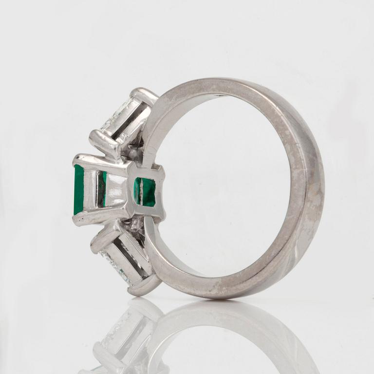A circa 1.85ct emerald and trilliant-cut diamond ring.