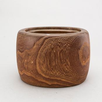 A set of four bronze giurines, a wooden bowl, two stands and one porcelain cup with stand, 20th century.