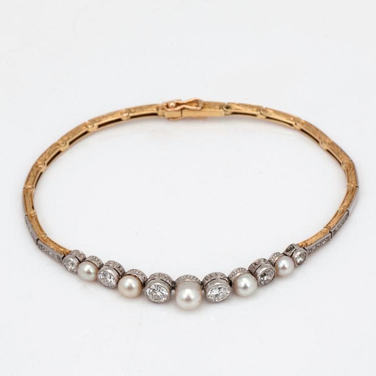 An Edwardian pearl and diamond bracelet.