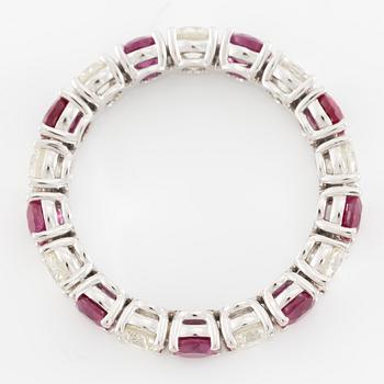 Ring, full eternity band, 18K white gold set with rubies and brilliant-cut diamonds.
