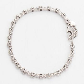 Rannekoru, 18K valkokultaa ja timantteja n. 0.78 ct yht kaiverruksen mukaan.