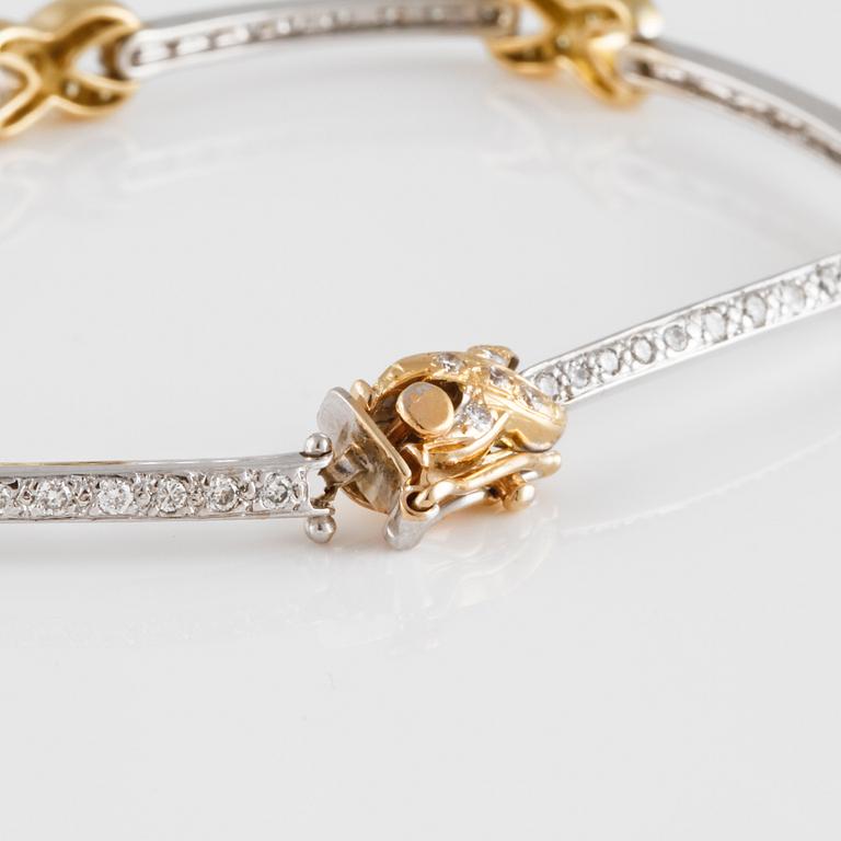ARMBAND, 14K guld och vitguld med briljantslipade vita och gula diamanter ca 1.30 ct.  Vikt 12,7 gram.