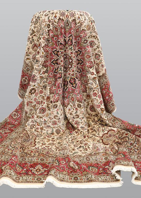 A carpet, Tabriz part silk, so called 50 Raj, cm 400 x 300 cm.