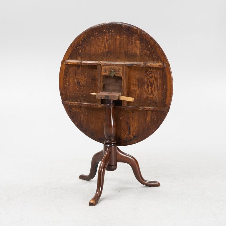 A tilt-top table.