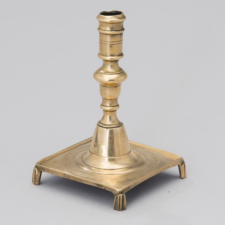 A brass candlestick from the end of the 17th century.