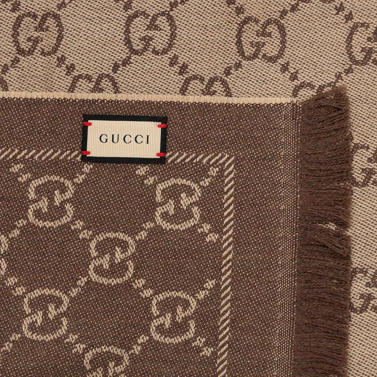 Gucci, a wool 'GG Jaquard Knitted Scarf'.