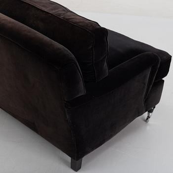 A contemporary velvet Howard sofa.