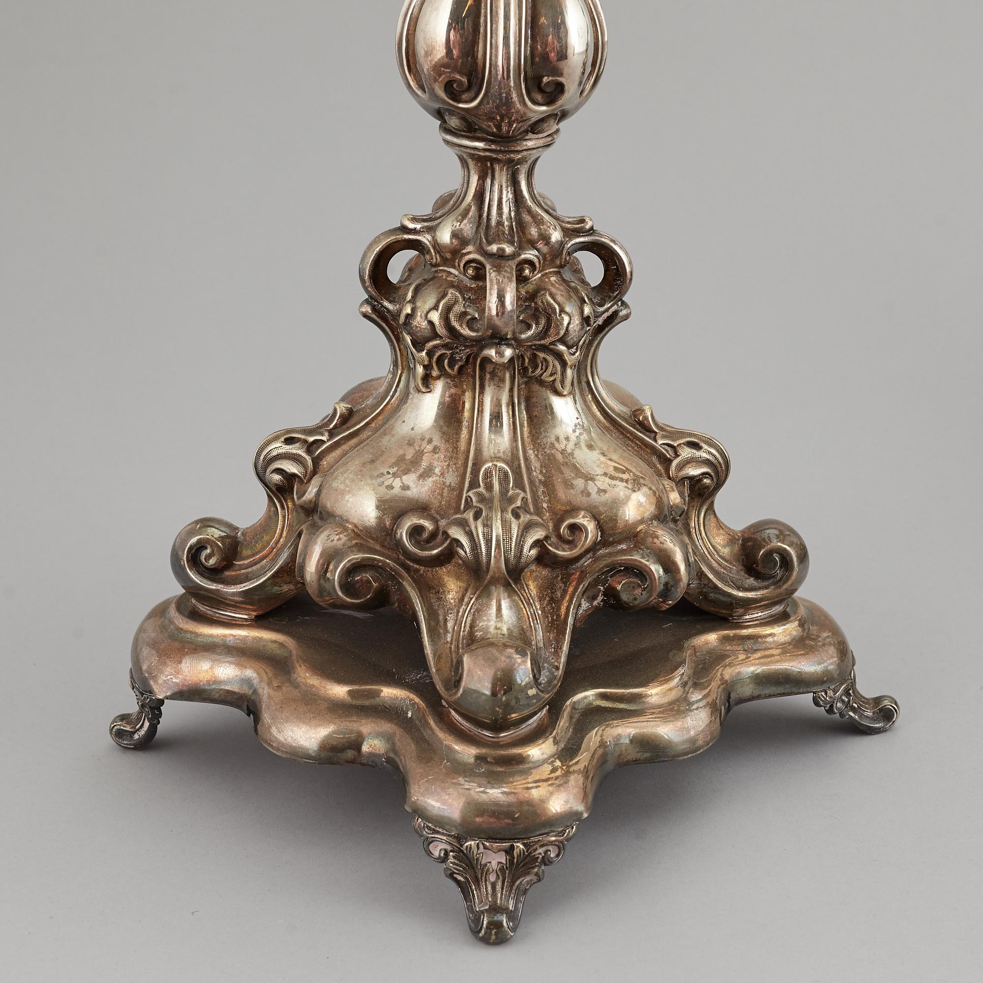 A pair of barocque style nine lights candelabra, silver plate, 20th Century.