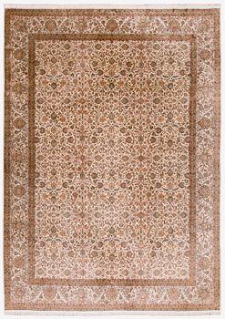 A silk carpet, Kashmir, circa 312 x 425 cm.