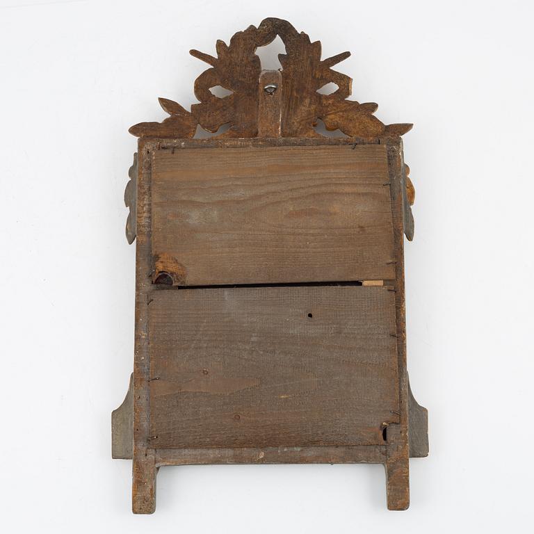 A Gustavian style mirror, around the year 1900.
