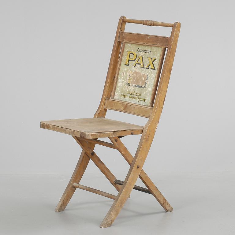 STOL, med reklamskylt, 1900-talets första hälft.