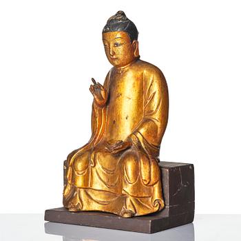 A gilt and polychrome lacquer figure of a divinity, 16th/17th century.
