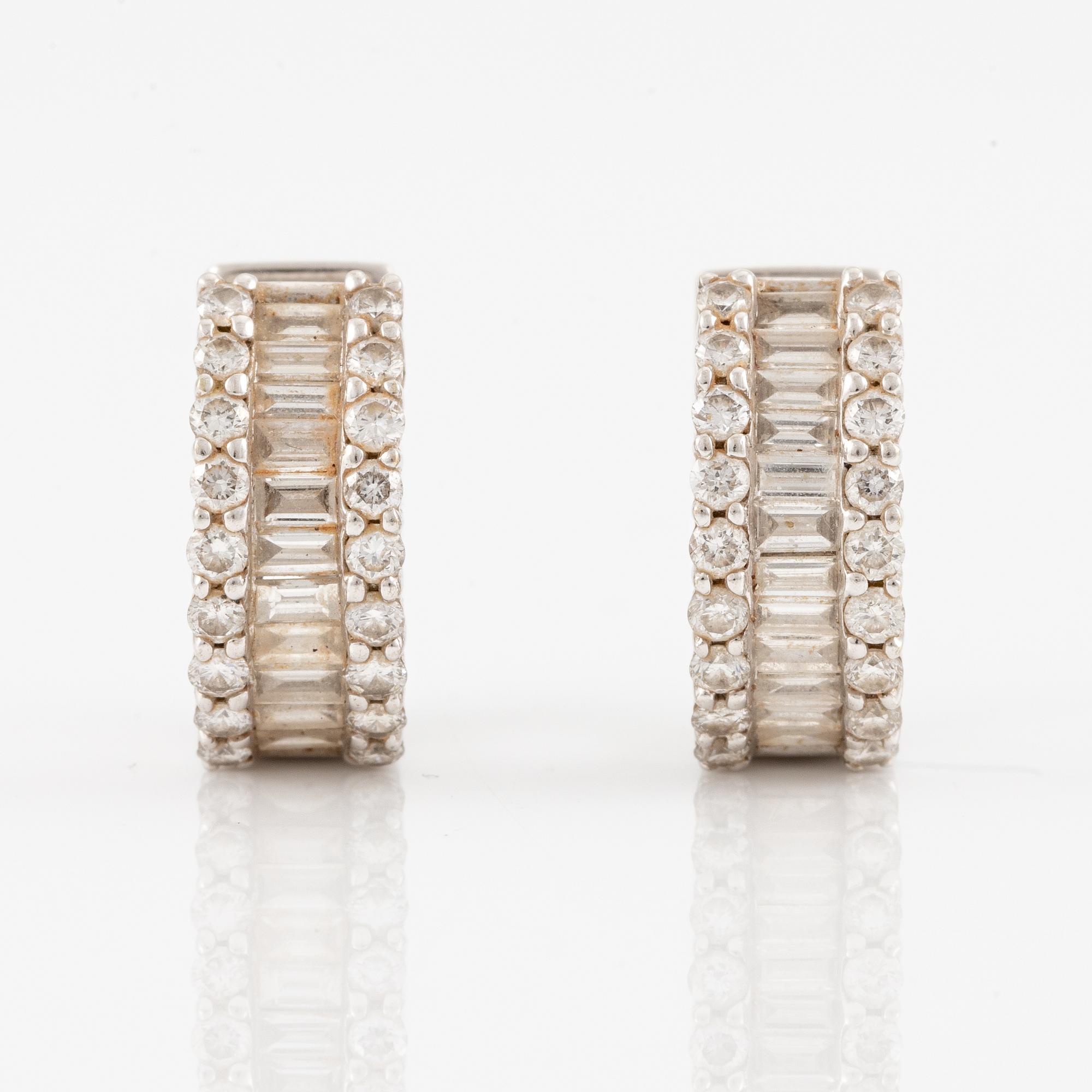 Earrings, a pair, 18K white gold set with baguette and brilliant-cut diamonds.