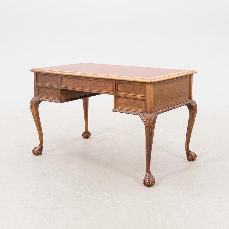 A mid 1900s Chippendale style mahogany desk.