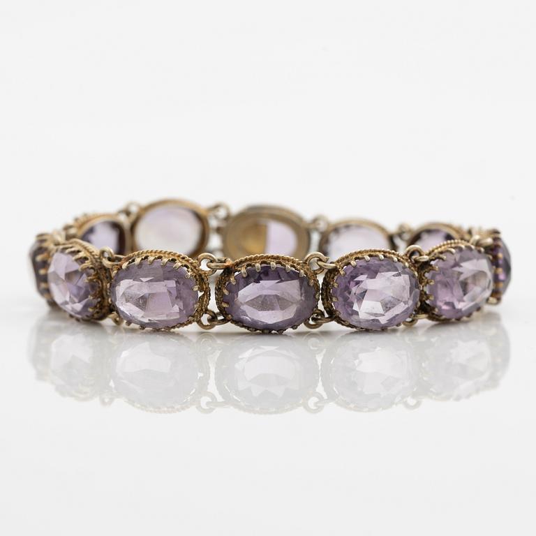 Garniture, necklace and bracelet silver with amethysts, brooch gold-coloured metal with purple paste stones,
