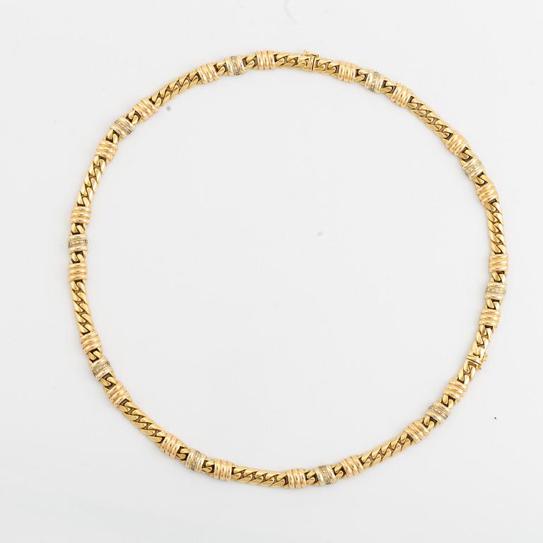 An 18K gold necklace/bracelet combination set with brilliant-cut diamonds.