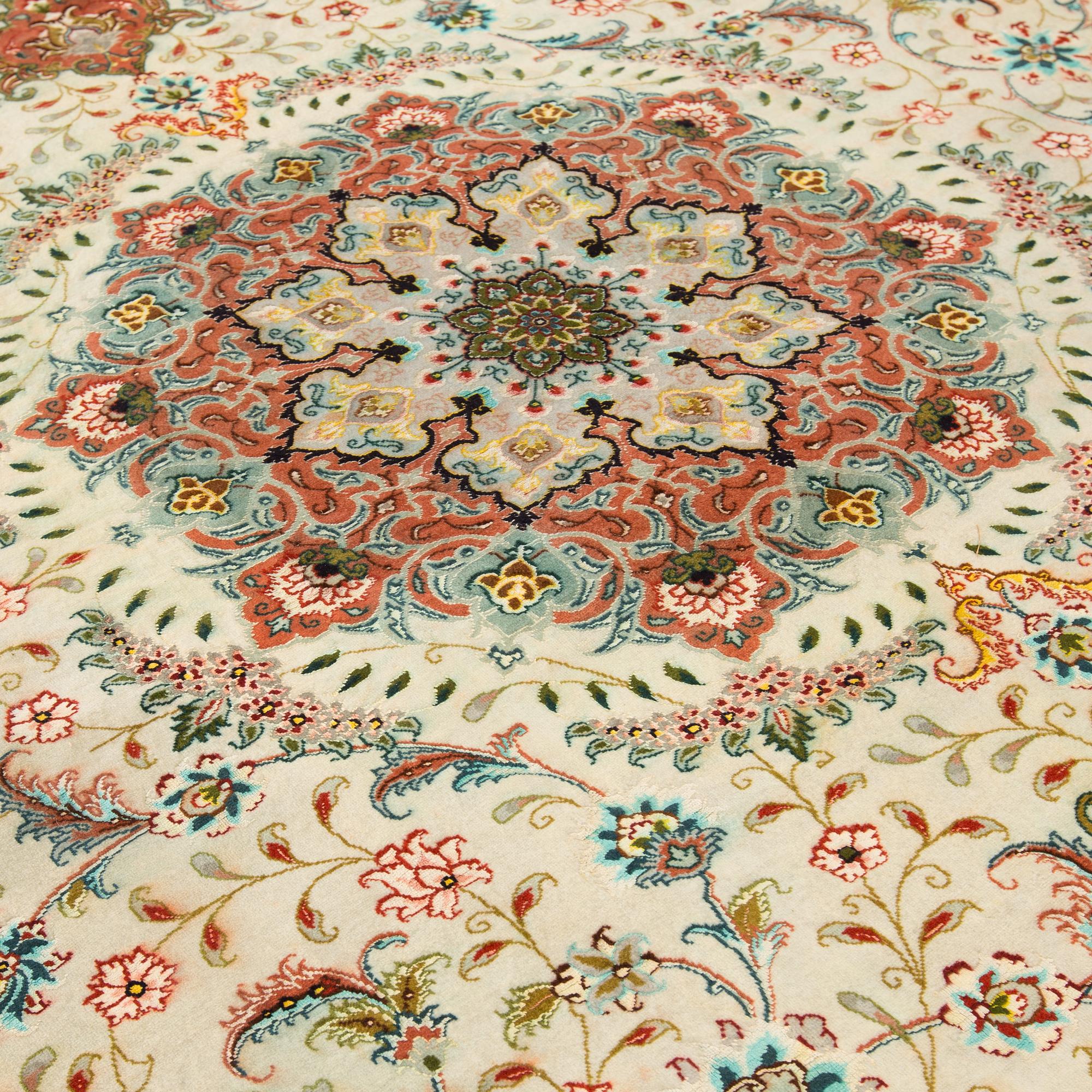 A carpet from Tabriz, part silk, ca 289 x 200 cm.