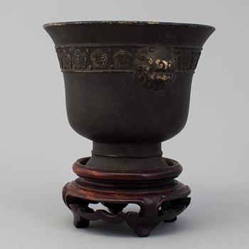 A chinese bronze incense burner and wooden stand, ca 1900s.