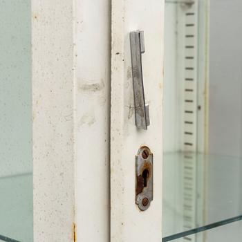 A metal doctor's cabinet, mid 20th century.