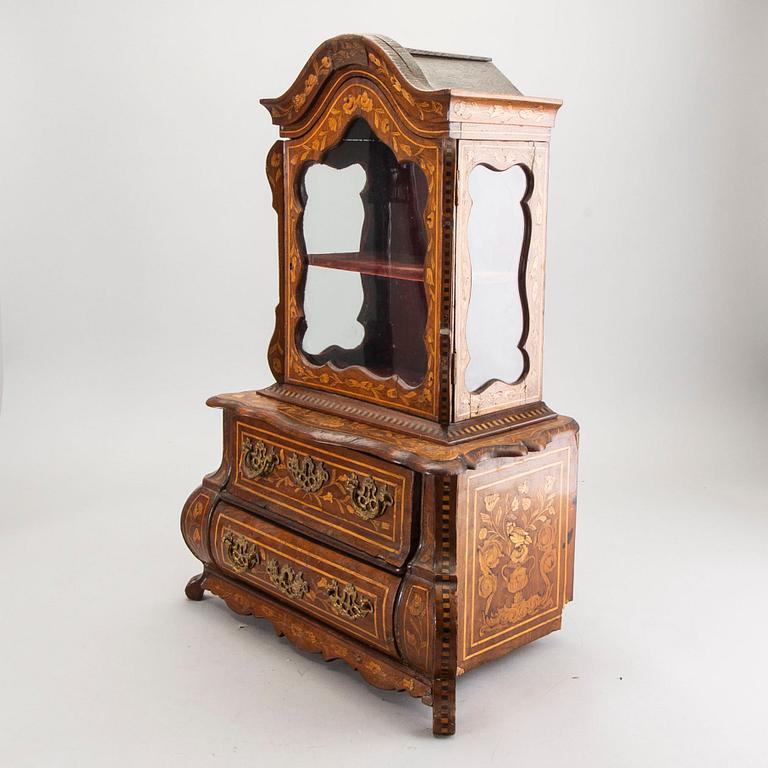A Louis XV-style miniature cabinet around 1900.