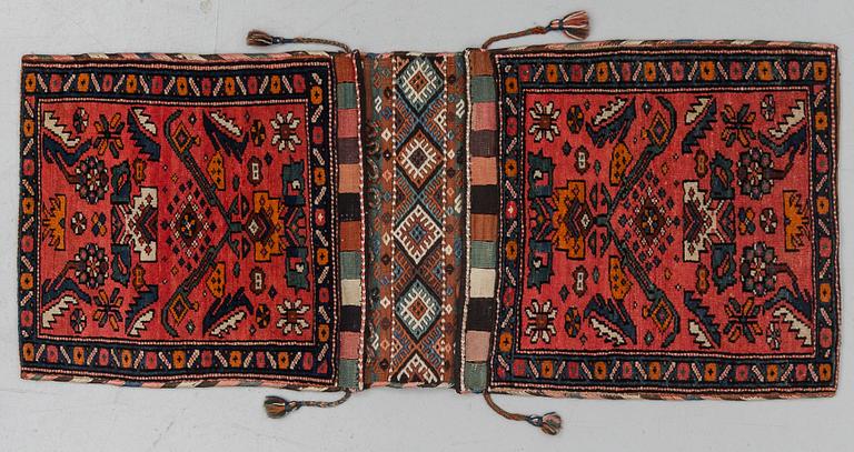 A semi-antique west persian saddlebag, circa 127 x 54,5 cm.