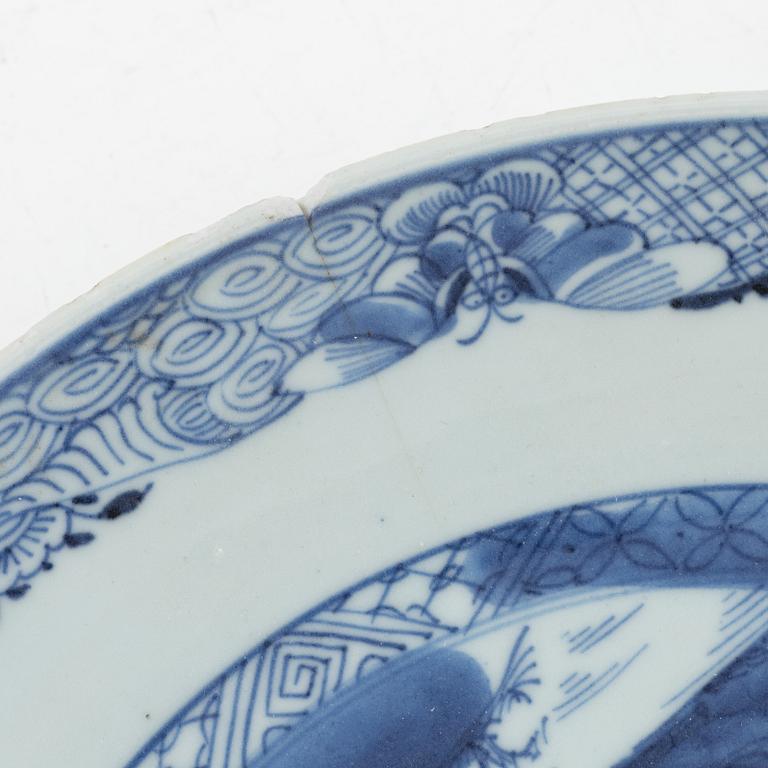 A pair of blue and white Chinese porcelain plates and a deep serving dish, Qing dynasty, 18th century.