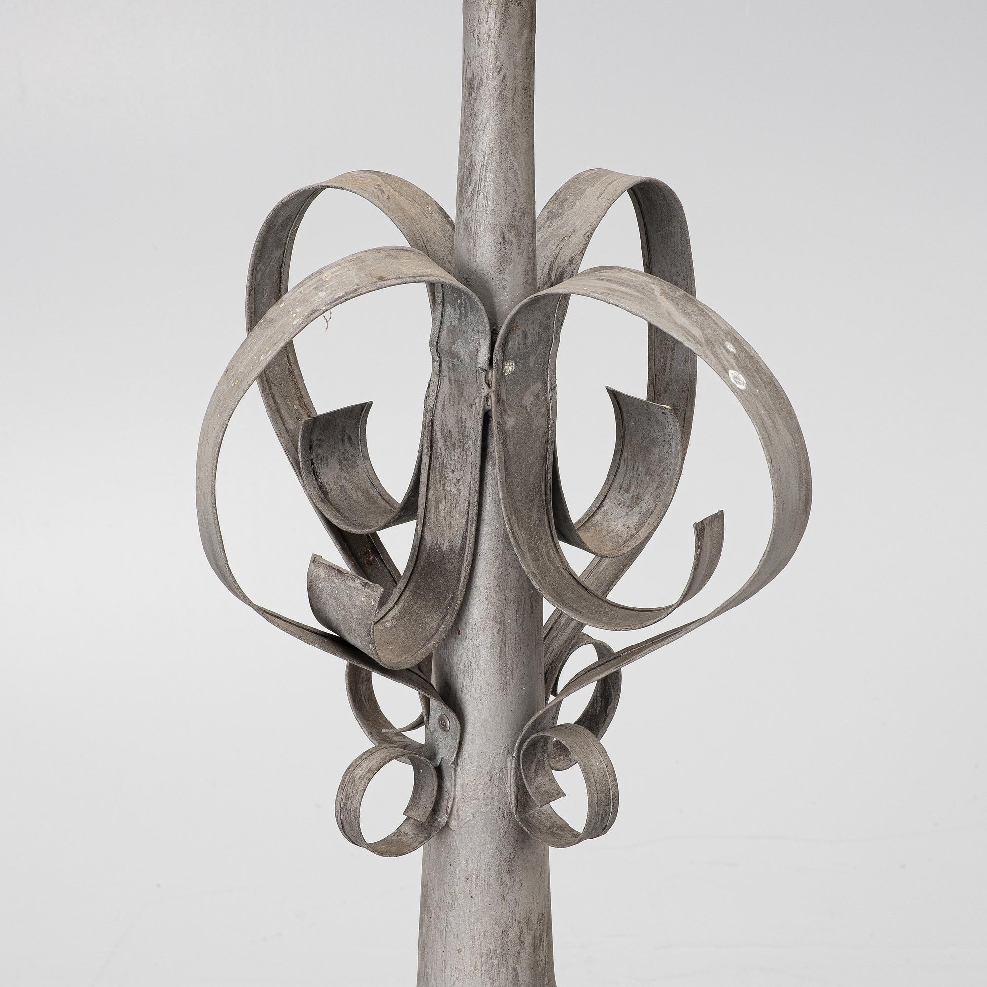 Tower spire with weather vane dated 1912.
