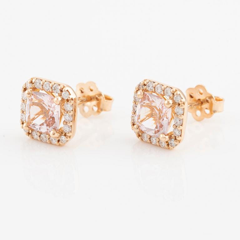 A pair of 18K gold earrings with faceted morganites and round brilliant-cut diamonds.