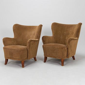 A pair of mid 20th century armchairs.