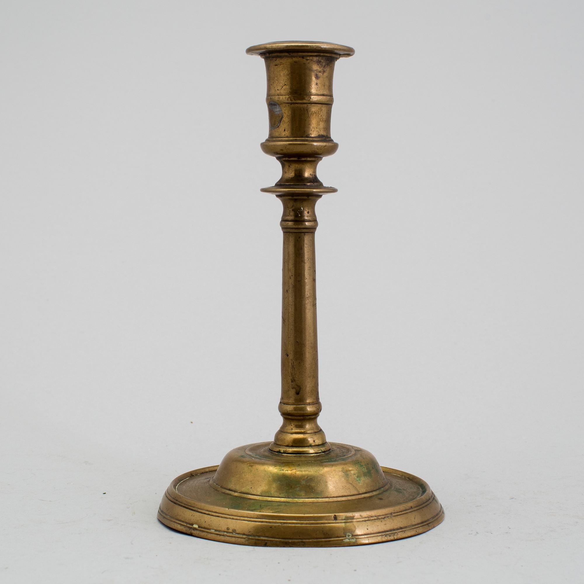 A 1500s bronze candlestick.