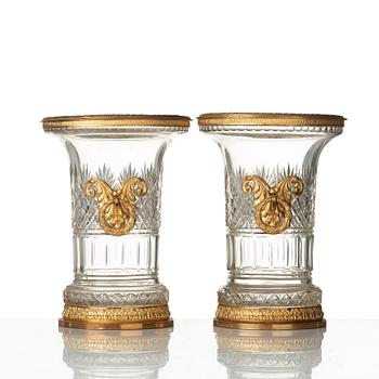 A pair of Empire-style circa 1900 cut glass and gilt-brass urns.