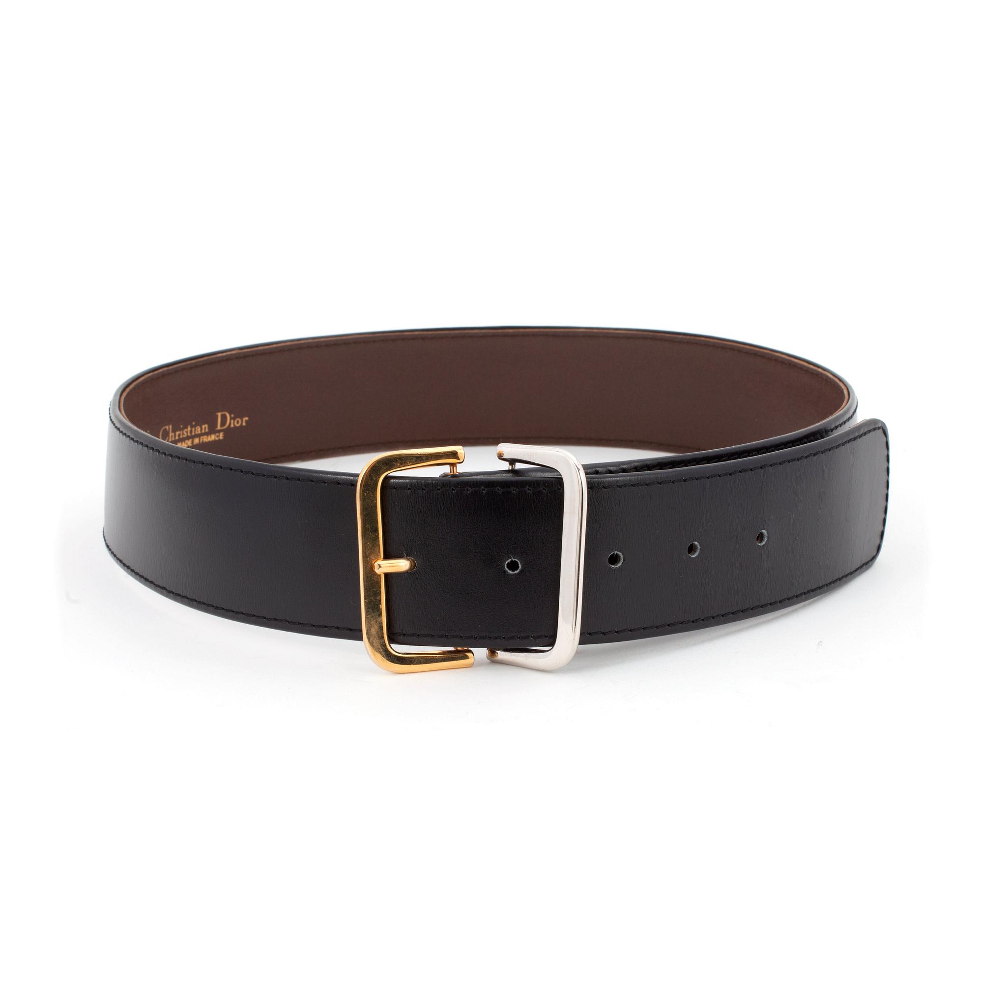CHRISTIAN DIOR, a black leather belt.