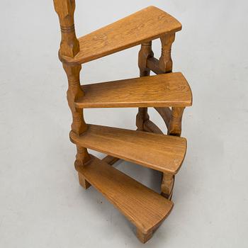 A late 20th century spiral library ladder.