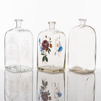 A set of seven glass bottles, 19th Century/circa 1900.