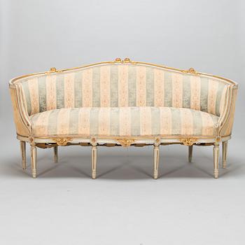 A Gustavian style sofa and table from early 20th century.