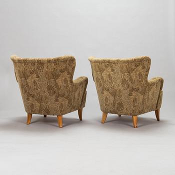 A pair of 1950s armchairs.