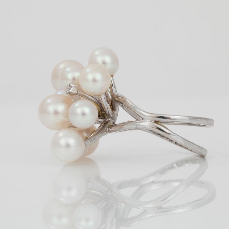 A cultured pearl and diamond ring.