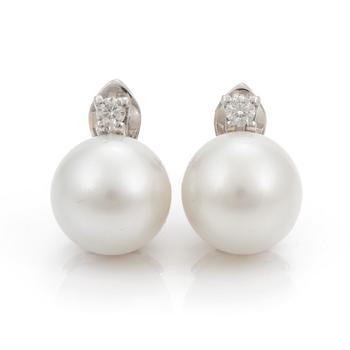 A pair of cultured South Sea pearl  and diamond earrings.