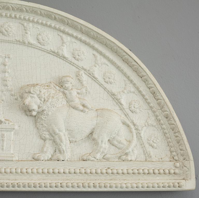 A late Gustavian carved and gesso crest, circa 1800.