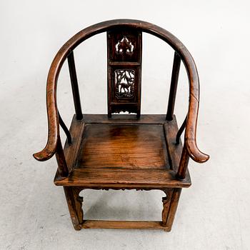A pair of Chinese hardwood armchairs, circa 1900.