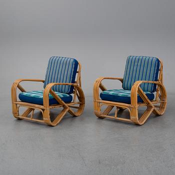 A pair of bamboo and rattan easy chairs, second half of the 20th Century.