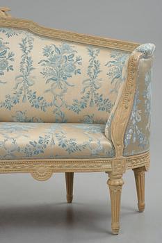 A grey-painted Gustavian 'canapé en corbeille'. sofa, later part of the 18th century.