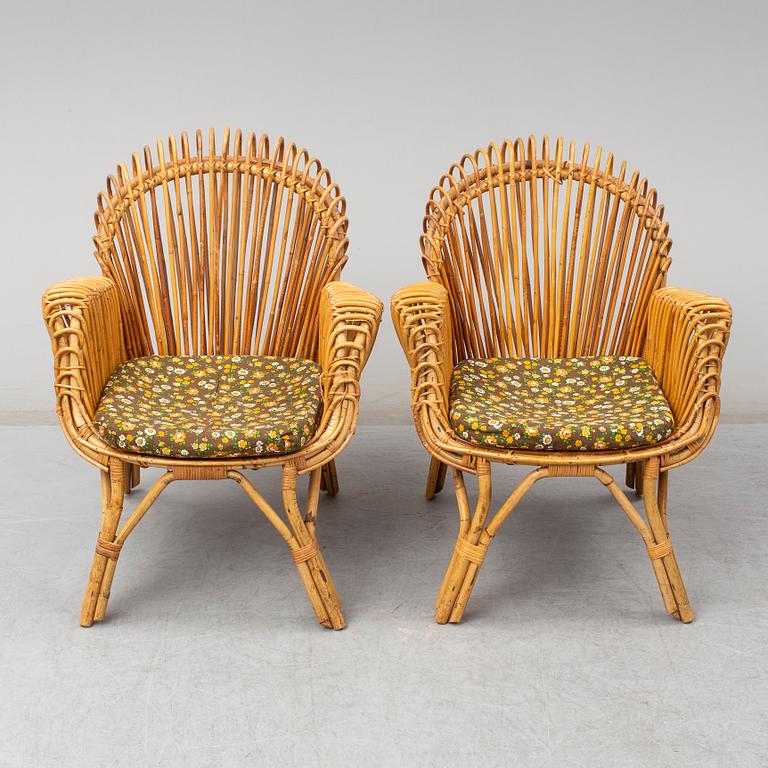 A pair of rattan armchairs, Emilio Paoli, via Vigna Nuova, 8, Firenze, Italy, second half of the 20th century. Signed.