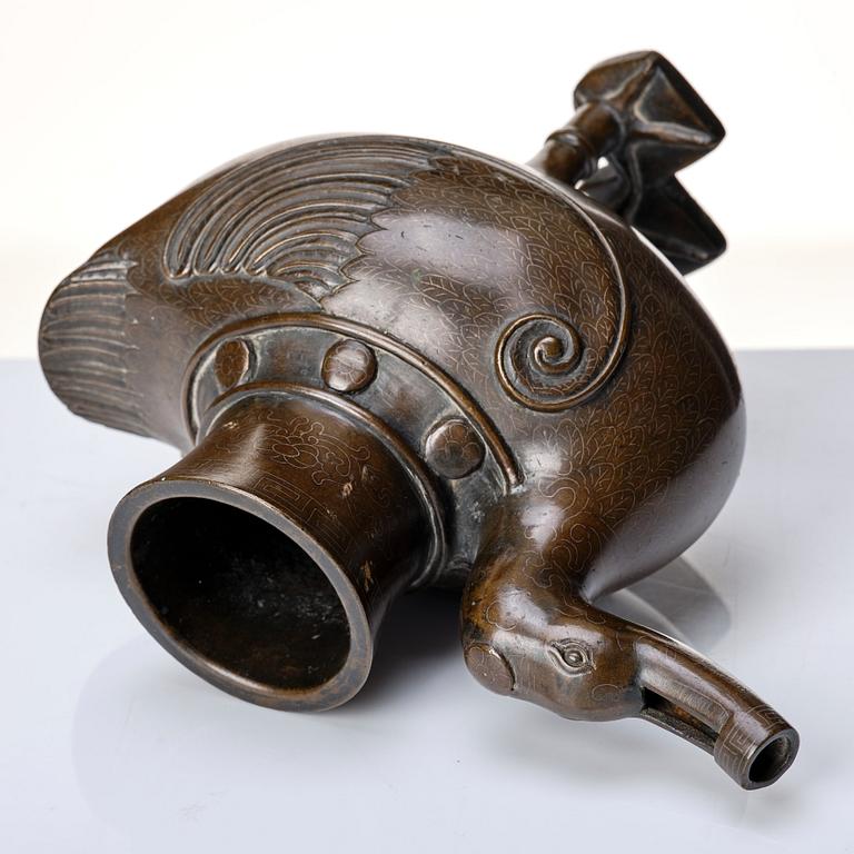 A bronze archaistic duck shaped vessel with silver inlay, Qing dynasty (1644-1912).