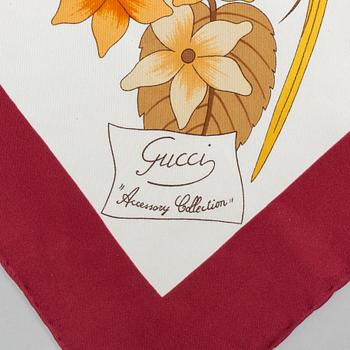 Gucci, a silk scarf.