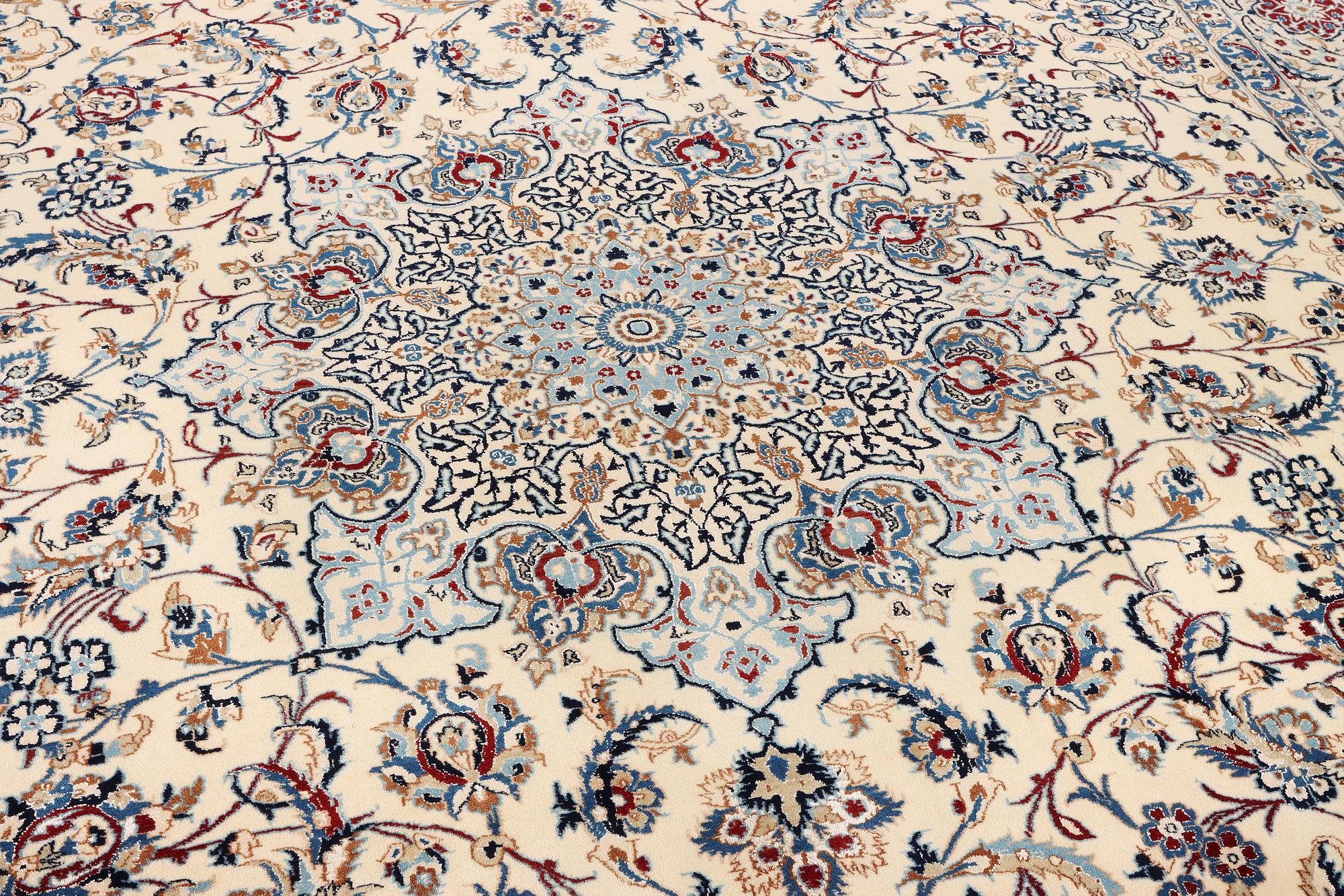 A Nain, part silk carpet, c. 474 x 322 cm.