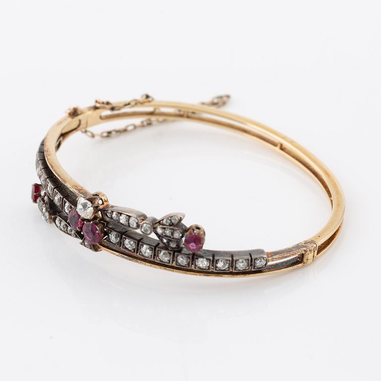 Arm ring in gold and silver set with old-cut and rose-cut diamonds and rubies.