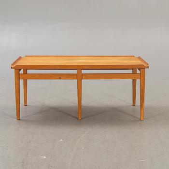A 1960s oak coffee table.